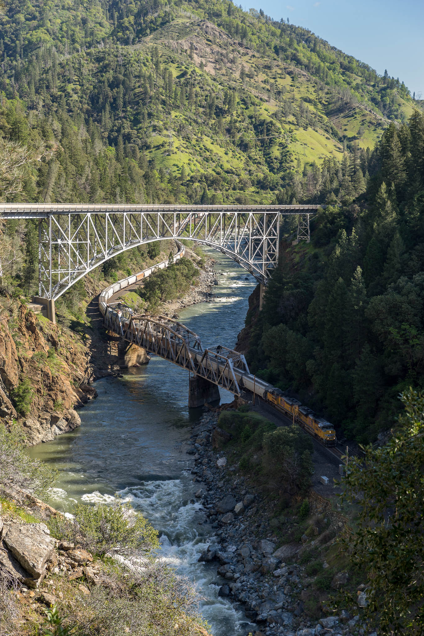 Feather River flowing through a deep canyon with train and highway bridges crossing over it