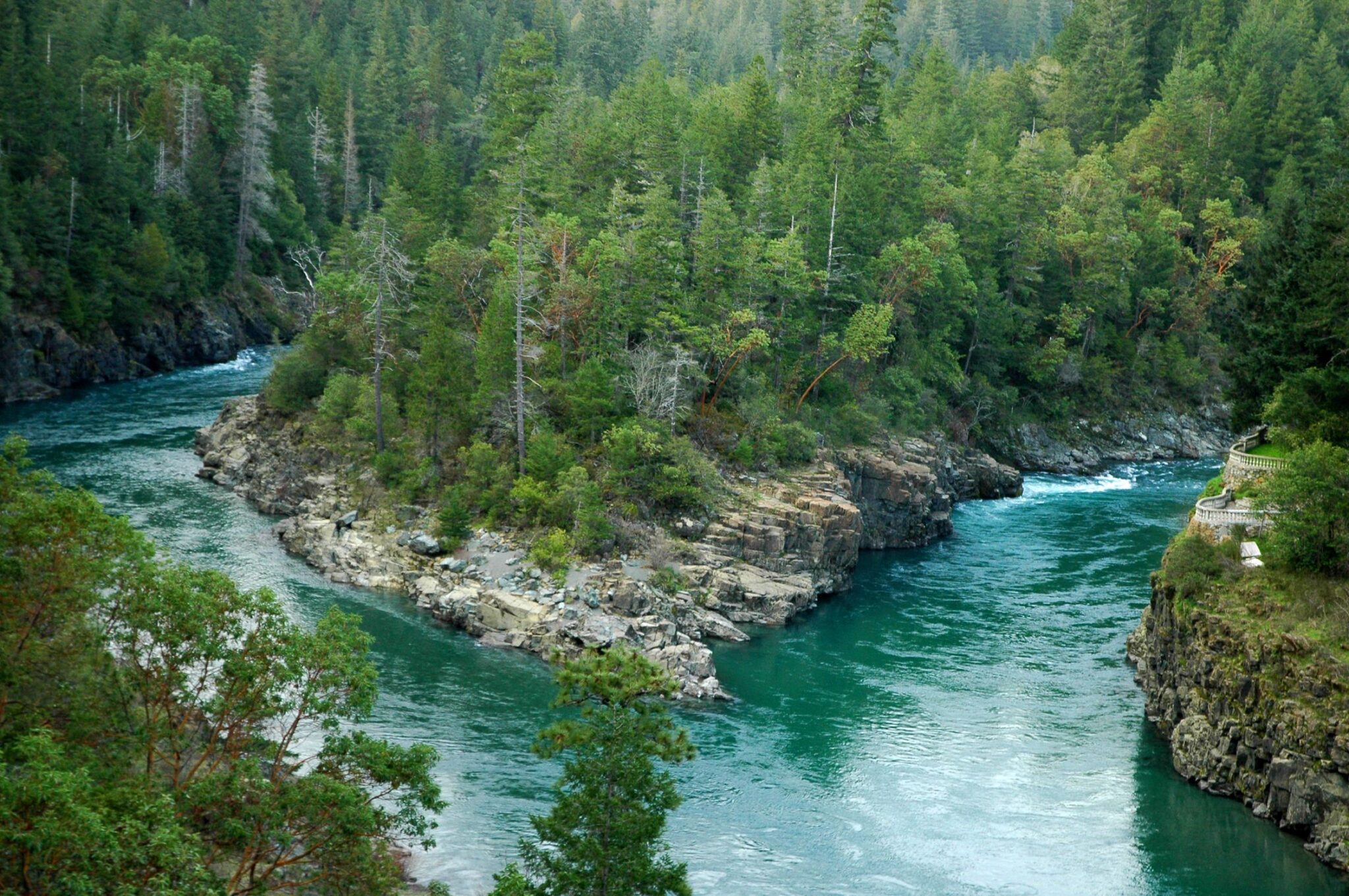Yuba River with turquoise-green water flowing through a canyon with steep rocky walls